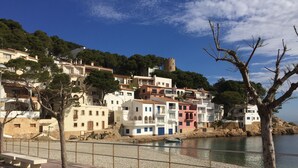 A coastal town with colorful buildings, a castle, and a river. - Holiday Home 'Villa La Veleta On Costa Brava' with Sea View, Private Pool and Wi-Fi (Begur)