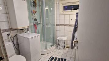 Shower, hair dryer, towels, toilet paper