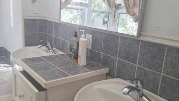 Shower, jetted tub, towels, soap