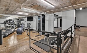 A gym with treadmills, elliptical machines, and weightlifting equipment. - Hebrews 13:2- Wonderful 2 bedroom condo downtown Waco, Baylor, Silos (Waco)