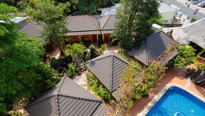 A residential area with multiple houses, a swimming pool, and a small garden. - Duy Ngoc Resort Phu Quoc (Phu Quoc)