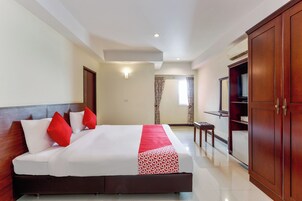 Desk, laptop workspace, bed sheets