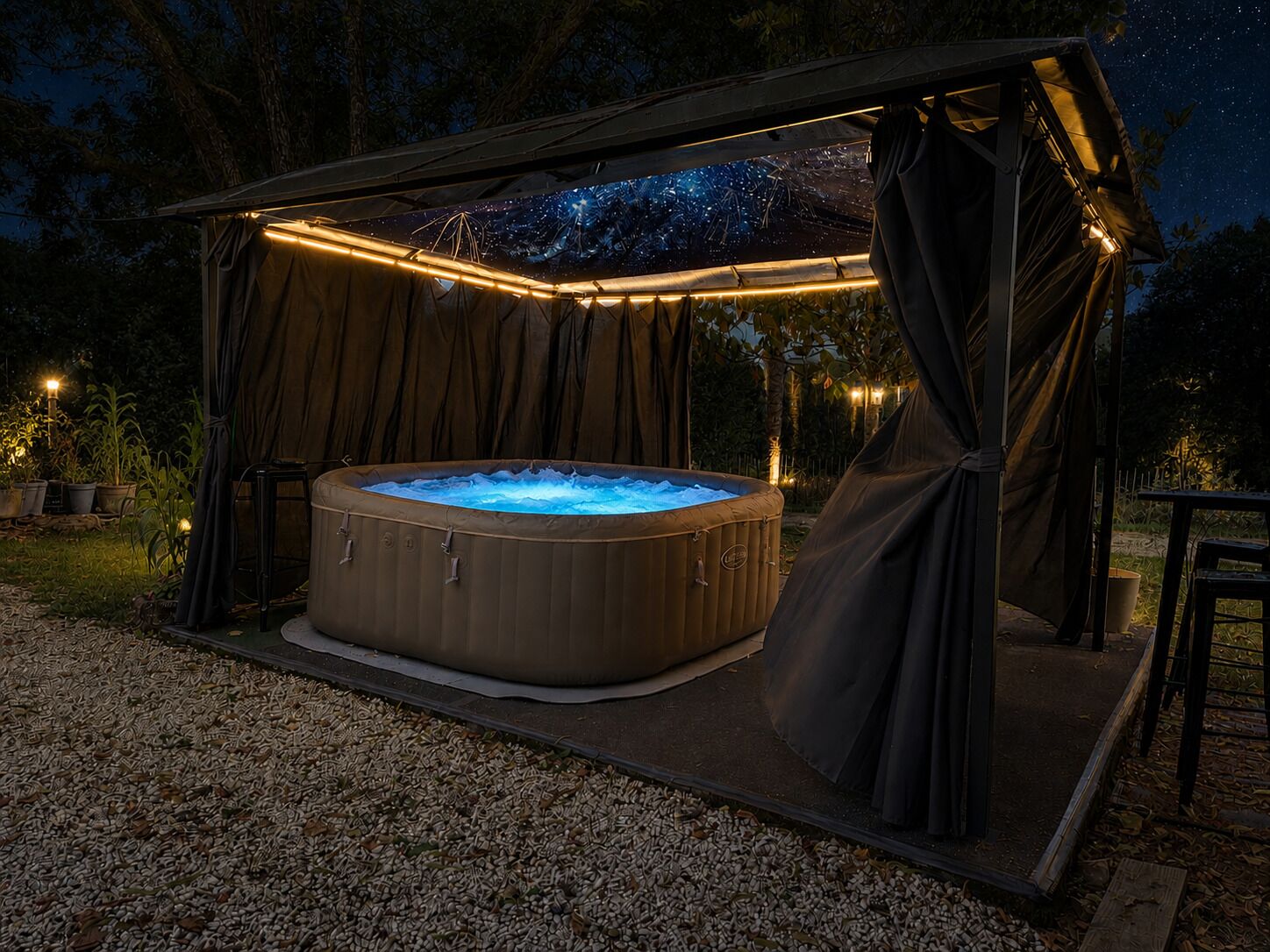 A hot tub under a covered area with a starry sky view.