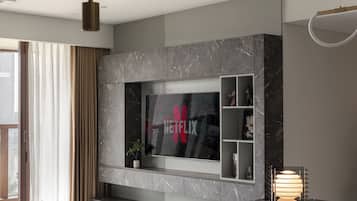 Deluxe-huoneisto, 4 makuuhuonetta, parveke, kaupunkinäköala | Ylelliset vuodevaatteet, pillowtop-patjalliset sängyt