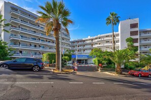 Stunning hotel with modern design, surrounded by lush greenery and a tranquil atmosphere.