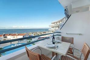 Enjoy a romantic dinner for two on this balcony overlooking the marina and sea.
