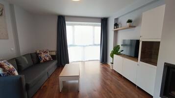 Departamento, 1 habitación, chimenea, vista a la ciudad | Sala de estar