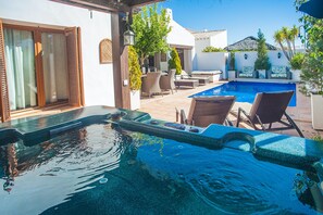 A swimming pool with lounge chairs and a patio area. - Special-offer Luxuriousvilla, Baños y Mendigo, Spain-perfect for Families&groups (Murcia)