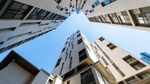 A high-rise building with a modern architectural design, featuring multiple balconies and large windows. - The Assembly (Manchester)