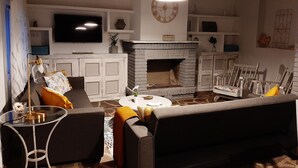 A living room with a fireplace, sofa, TV, and decorative items. - Casa Rural Garnacha de Borja has a Barbacue and Terrace (Borja)