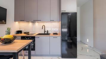 Deluxe Apartment, 2 Bedrooms, Beachside | Private kitchen | Oven, stovetop, electric kettle, toaster