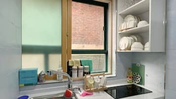 Mini-fridge, microwave, cookware/dishes/utensils, spices