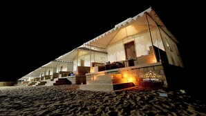 A desert tent with multiple rooms and a staircase leading to the entrance. - Desert Popular Resort & Camp (Jaisalmer)