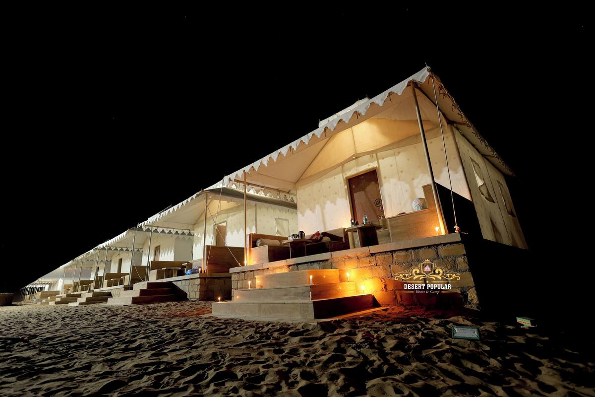 A desert tent with multiple rooms and a staircase leading to the entrance.