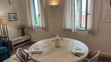 Family Apartment, Garden View | Living area | Flat-screen TV