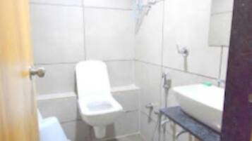 Shower, rainfall showerhead, towels, soap