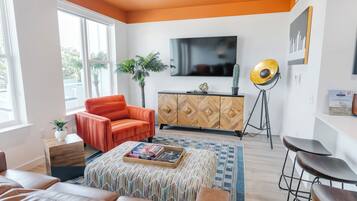 Signature Suite, 1 King Bed with Sofa bed, Balcony | Living area | LED TV