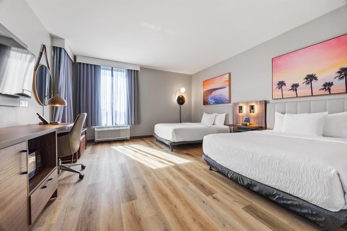 Deluxe Room, 2 Queen Beds, Non Smoking (Bathtub) | Desk, laptop workspace, iron/ironing board, travel crib