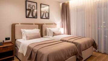 Down comforters, memory foam beds, desk, laptop workspace