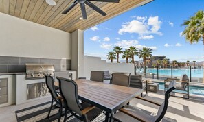 Relax in style with a grill and comfortable seating area overlooking the pool and surrounding mountains.