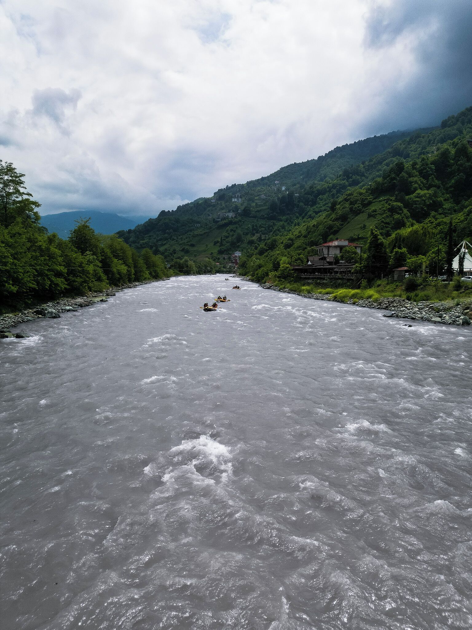 A river with a group of people rafting.