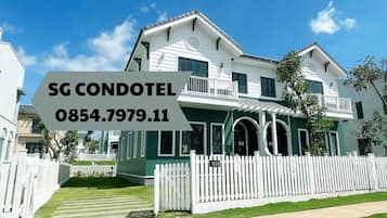 Experience a serene environment with multiple balconies and a well-maintained lawn.