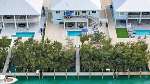 A coastal hotel with multiple buildings, a pool area, and a dock. - Blue Pearl Waterfront Oasis w Pool 70 Dock (Marathon)
