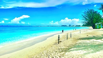 Beach nearby, white sand, sun loungers, beach umbrellas