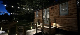 A peaceful countryside retreat with a private hot tub and cozy log burner.