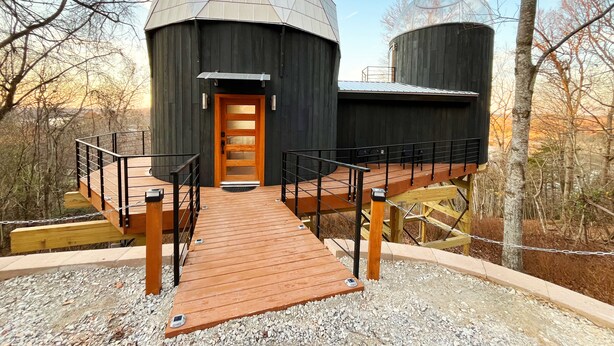A dome-shaped building with a wooden door and a wooden deck leading to it. - 🌟Planetarium Treehouse🌟Stargazing Observatory with Beaver Lake Views (Springdale)