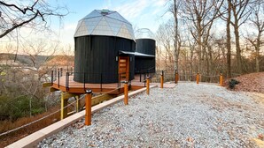 A modern building with a dome structure, a wooden deck, and a gravel path. - 🌟Planetarium Treehouse🌟Stargazing Observatory with Beaver Lake Views (Springdale)