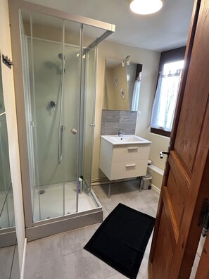 Shower, hair dryer, towels, soap