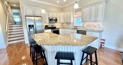 Sunny shore escape—steps to beach, boards & family fun!
