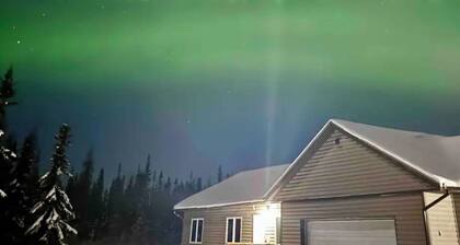 Aurora viewing 3BR/2BA home, plus heated 2 car garage, North Pole, AK.