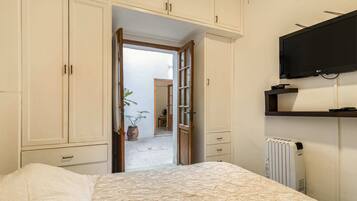 1 bedroom, desk, iron/ironing board, travel crib