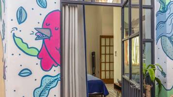 1 bedroom, desk, iron/ironing board, travel crib