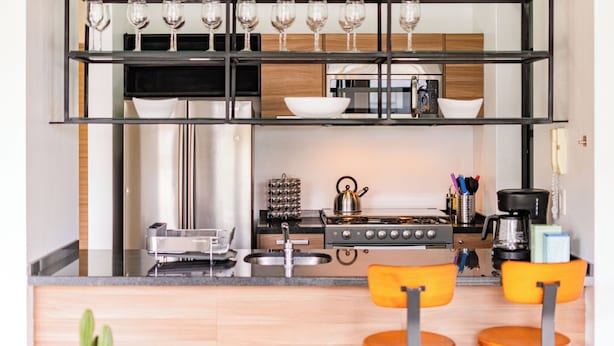 A modern kitchen with a central island, a stove, and a coffee maker. - NEW Perfect Location with Free Parking (Mexico City)