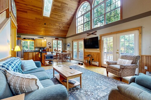 Spacious mountain house with a cozy fireplace, game room, and large deck