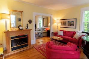 TV, fireplace, books, printers