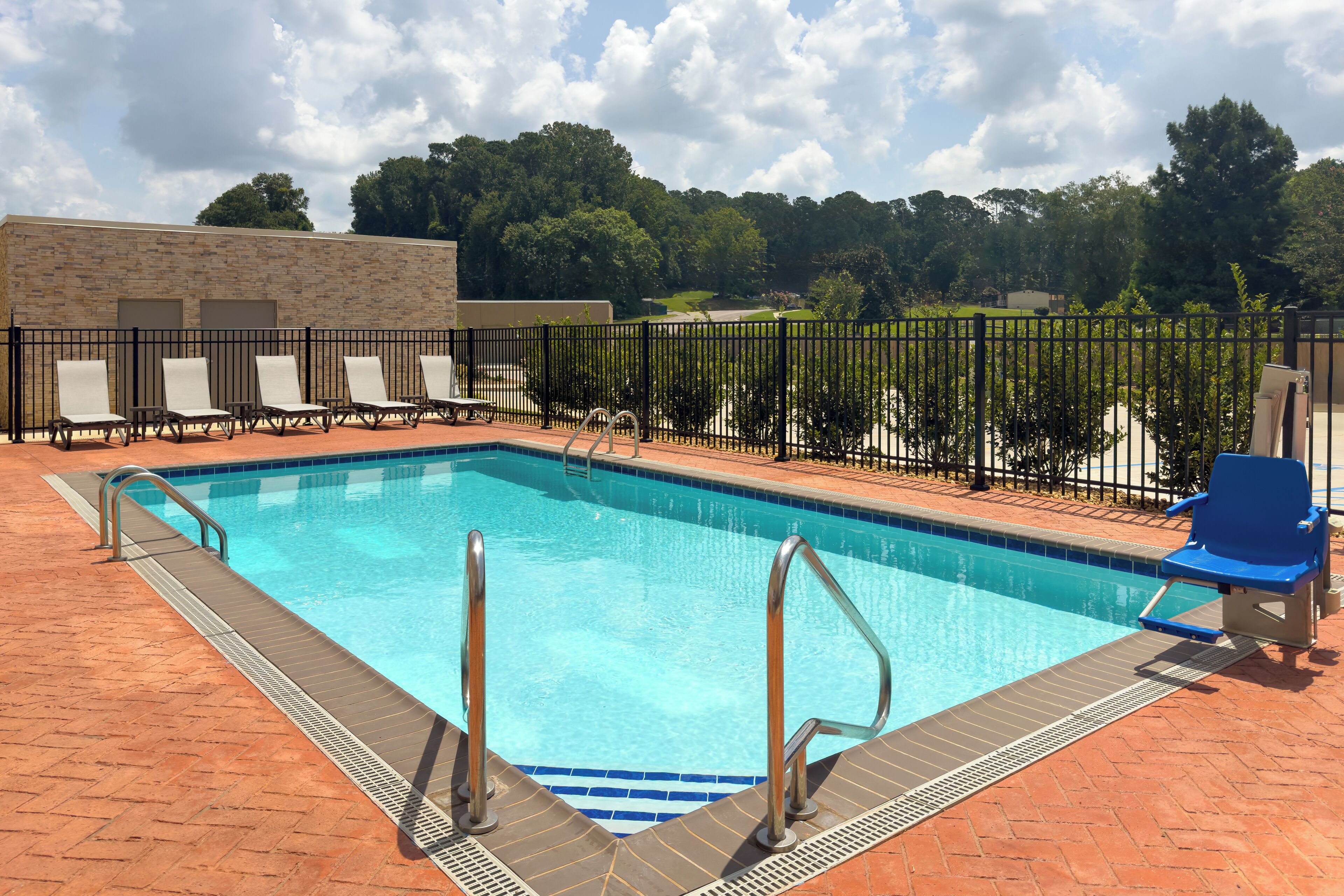 Seasonal outdoor pool, open 10:00 AM to 10:00 PM, pool umbrellas