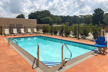 Seasonal outdoor pool, open 10:00 AM to 10:00 PM, pool umbrellas