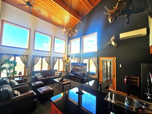 60-inch Smart TV with digital channels, video-game console, Netflix