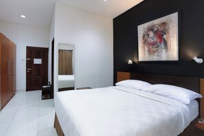 Habitación Deluxe | Espacio para trabajar con laptop, wifi gratis y ropa de cama 