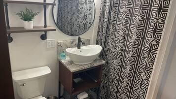 Shower, eco-friendly toiletries, hair dryer, towels