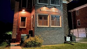 A two-story building with a brick facade and a sign that reads "One Thousand Third Ave."