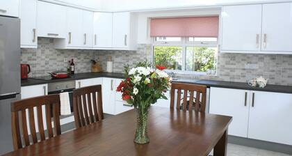 Cedar Cottage, across from  the river in Oughterard