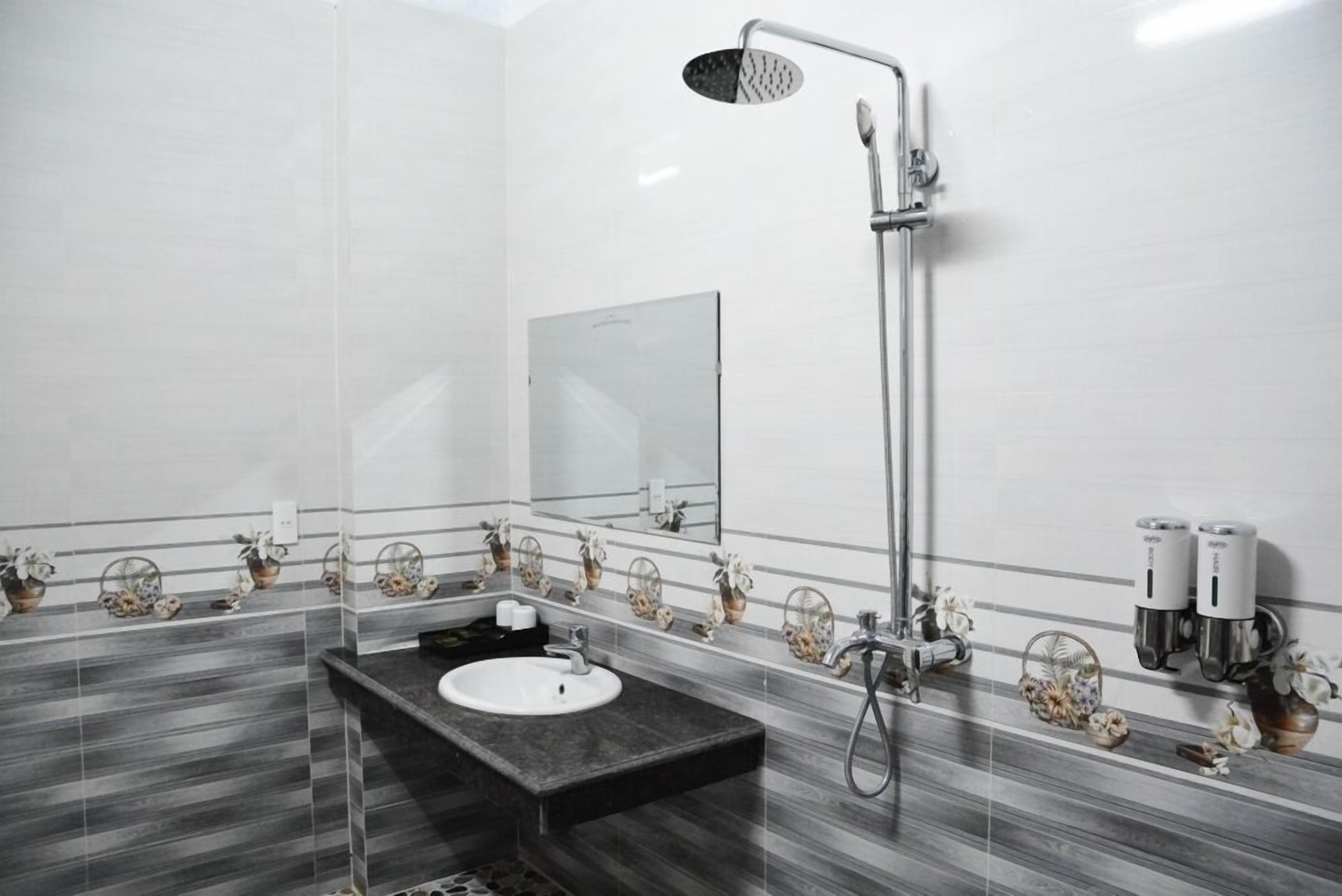 Shower, hair dryer, slippers, towels