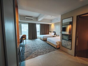 Junior Twin Room, 2 Double Beds | Minibar, in-room safe, desk, laptop workspace - The Tribute Hotel (Quezon City)
