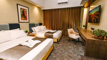 Deluxe Twin Room, 2 Double Beds | Minibar, in-room safe, desk, laptop workspace