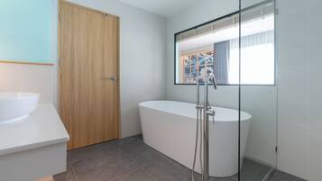 Deluxe Premier with Bathtub | Bathroom | Free toiletries, hair dryer, bathrobes, slippers